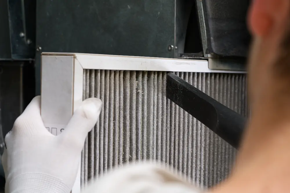 Fall and Winter HVAC Checklists For Homeowners In London, ON - Replacing filter in the central ventilation system. hvac filter replacing home central air system