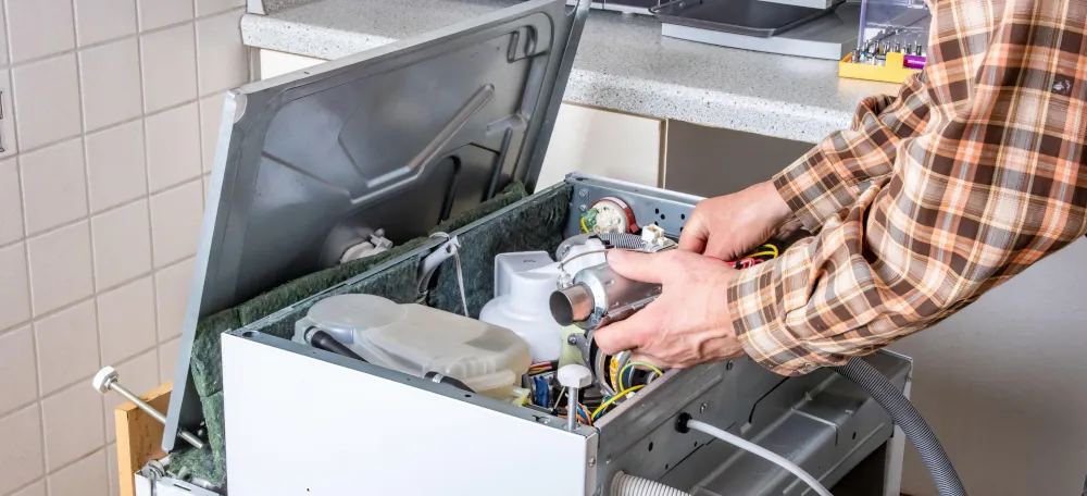 Appliance Repair - Technician working on an appliance.